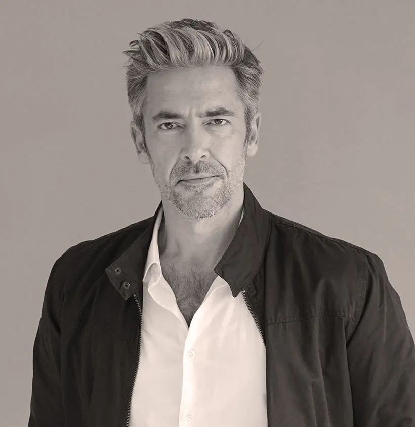 Handsome mature man standing considering facelift