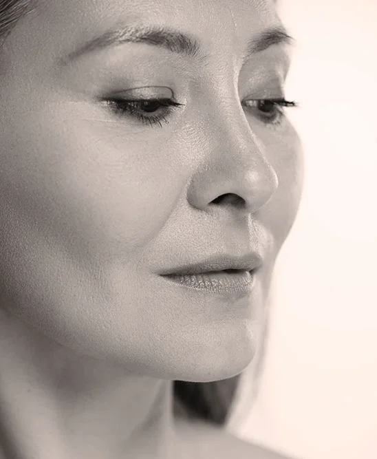 asian woman with perfect skin and grey hair